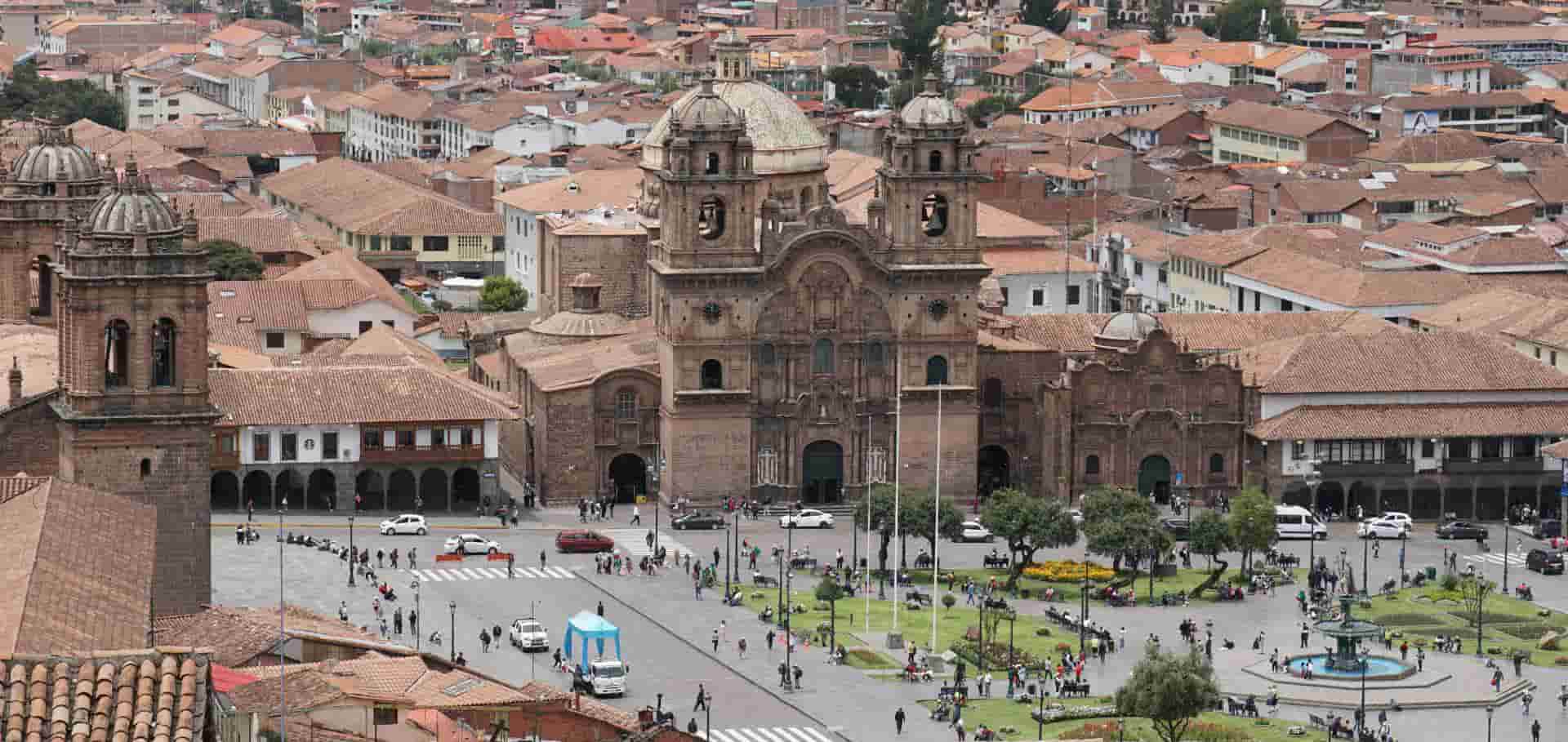 Aerial view of the bustling Plaza de Armas and historic colonial architecture in Cusco.