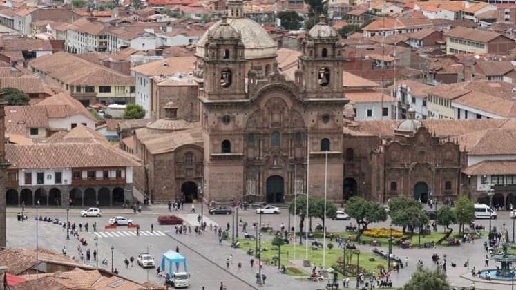 Aerial view of the bustling Plaza de Armas and historic colonial architecture in Cusco.