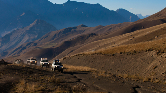Pickups driving through the desert