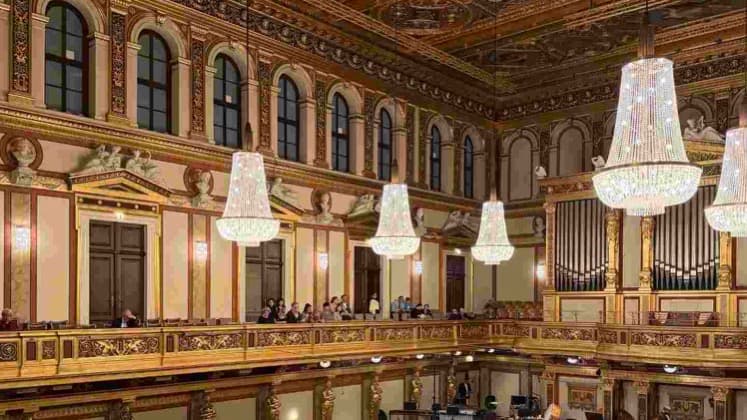 Gilded caryatids line the opulent neoclassical interior of the historic Golden Hall in Vienna