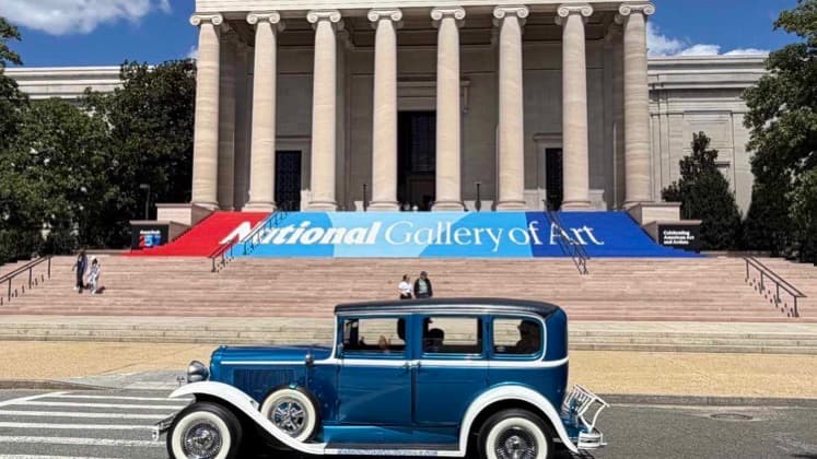 Vintage car passing in front of the main entrance of Washington DC National Art Gallery