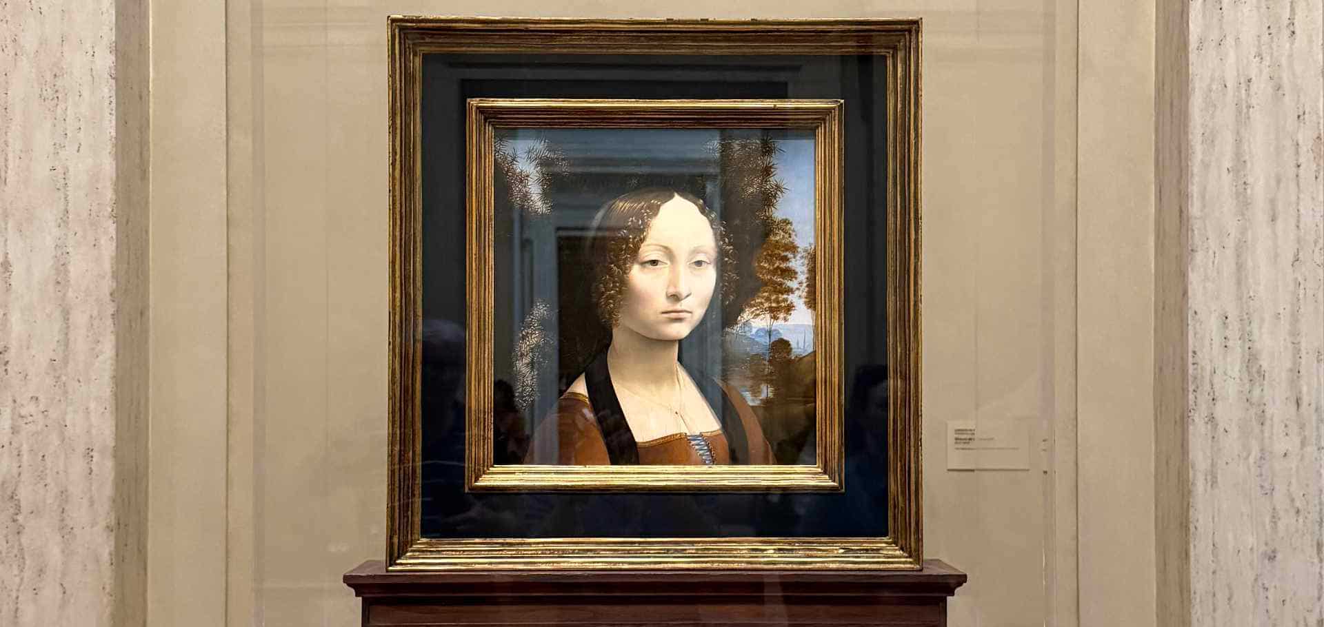 Leonardo da Vinci's portrait of Ginevra de' Benci displayed inside a protective glass frame.