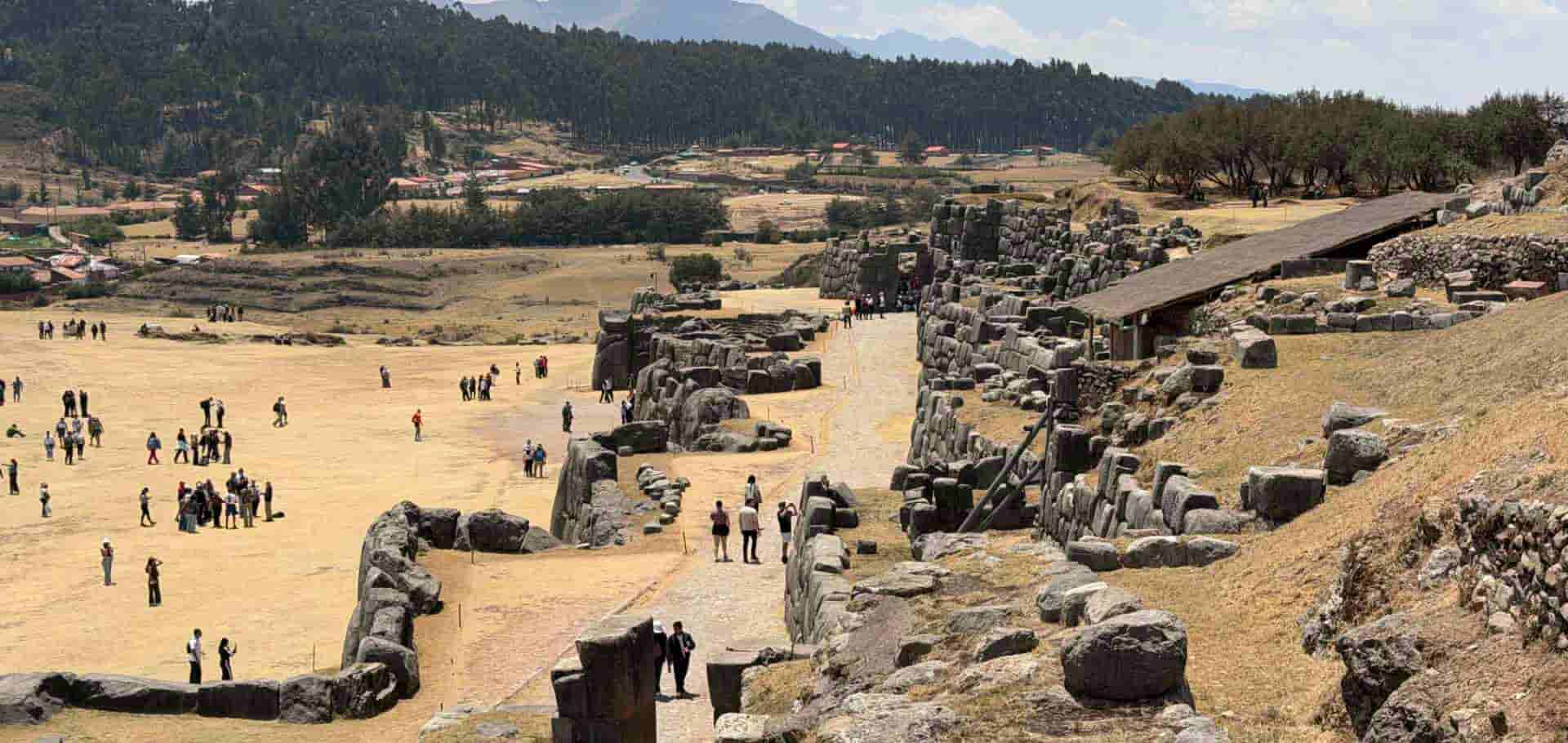 Expansive view of the massive stone megaliths and terraces at Sacsayhuamán.