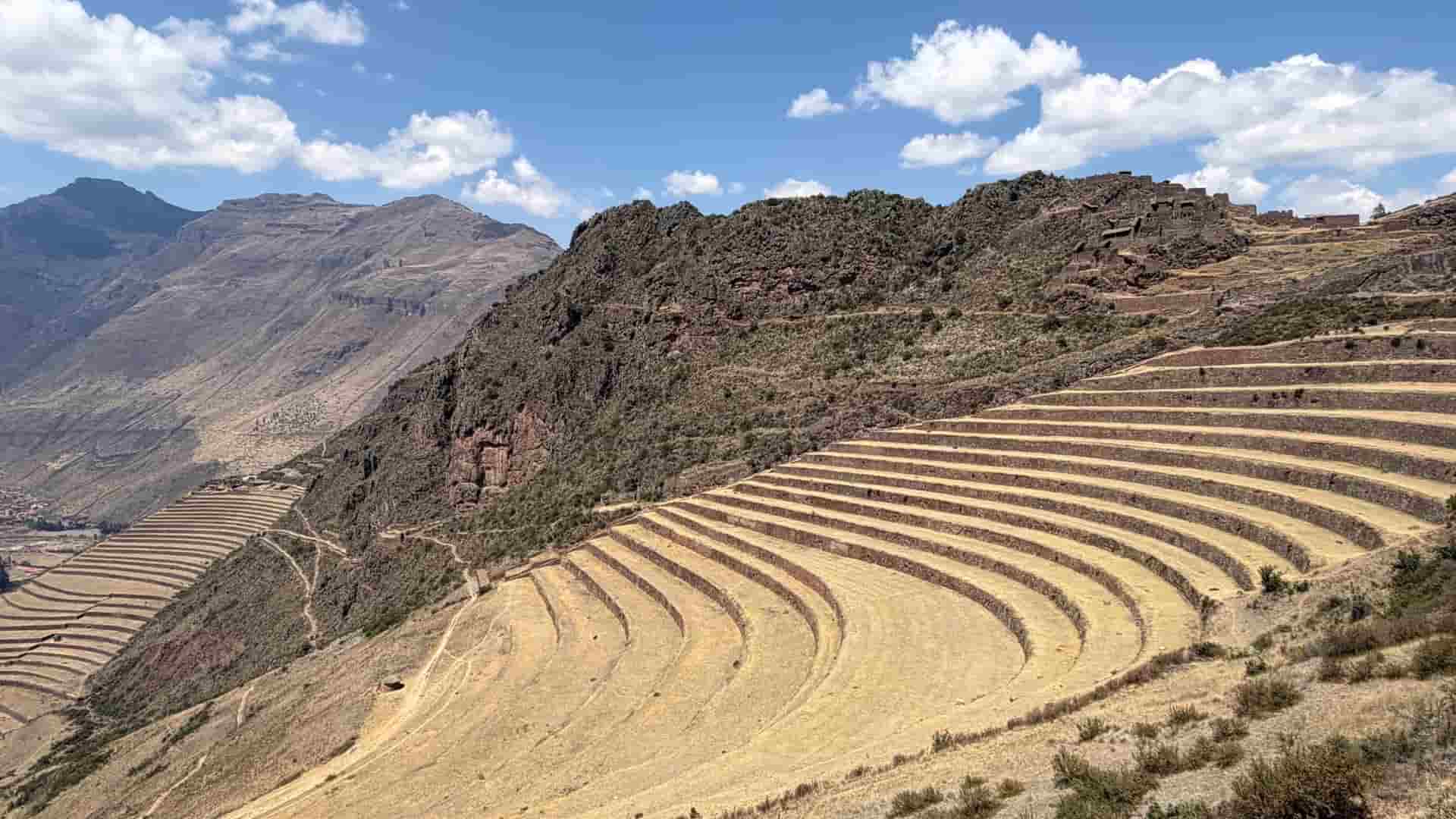 Sweeping agricultural terraces curving along the rugged mountain slopes of Pisac.