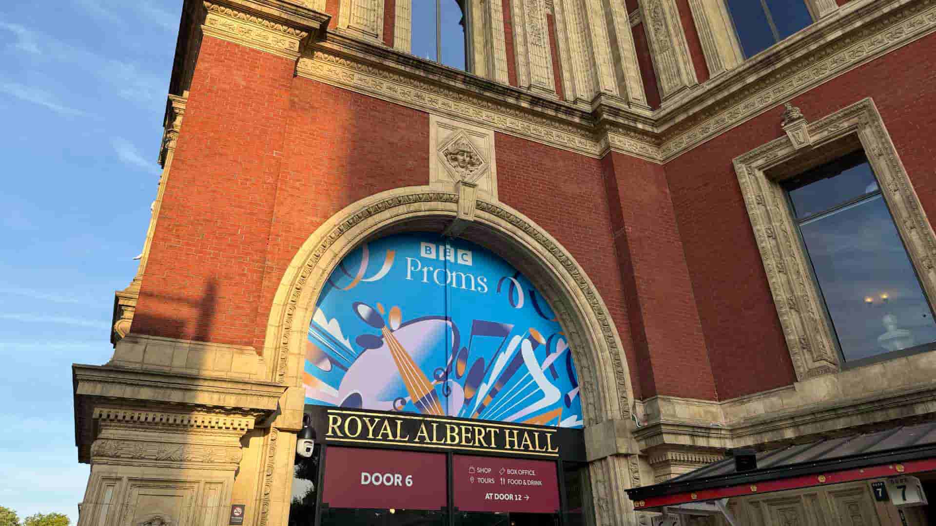 Grand red-brick exterior entrance archway of the historic Royal Albert Hall in London