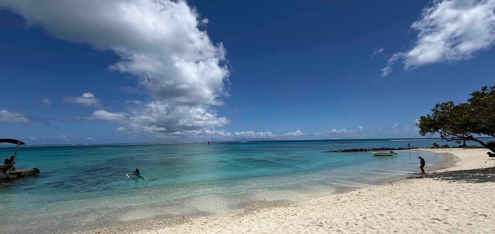 Clear turquoise water and white sandy beach at Maitai Lapita Village.