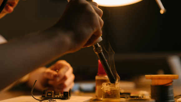 Craftman building a bracelet