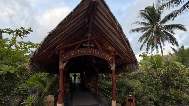 Thatched roof entrance pavilion at Maitai Lapita Village in Huahine.